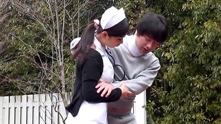 Japanese nurse sucking her patient's unearth outdoors in the park